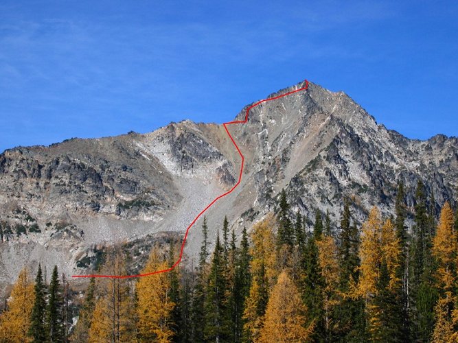 We went up a long rocky gully to a col on SW ridge, 
and then had to scramble steep terrain below the ridge crest to the summit.
There was a steep gully getting out of the col, and then we searched both north and south of the crest for a route.
We ended up on the south side, making a traverse below the crest on steep ledges and ramps,
and then going up another steep gully at the far end to get to the summit area.